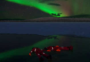 Ice Floating in Forest Lake with Aurora Borealis